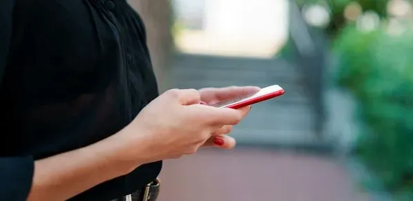 Person using mobile phone.